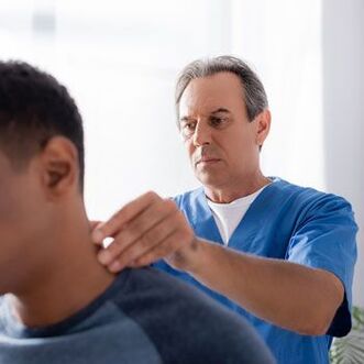 The doctor performs a diagnostic examination of a patient with neck pain