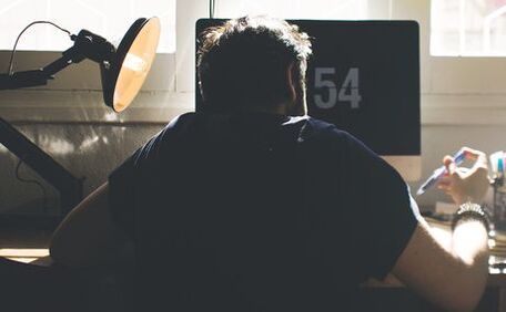 A man on a computer