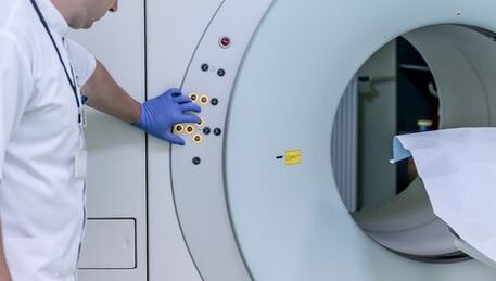 The doctor controls the MRI apparatus